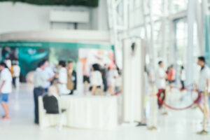 blurred background full of people in an exhibition area